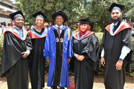 Chairman department of ophthalmogy,  Dr Stephen Gichuhi ,(center) with the 4 graduands